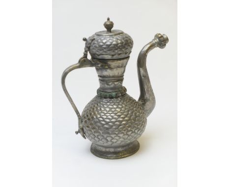 Eastern metal ewer, baluster form with fish scale decoration, height 18.5cm (Please note condition does not form part of the 