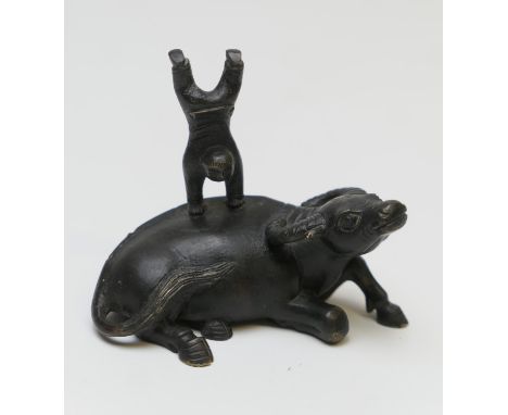 Chinese bronze scroll weight, cast as a water buffalo ridden by an acrobatic boy, height 7cm (Please note condition does not 