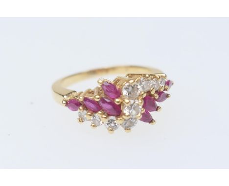 Diamond and marquise ruby cluster ring, centred with nine brilliant cut diamonds totalling approx. 0.5ct, in an S-shaped sett