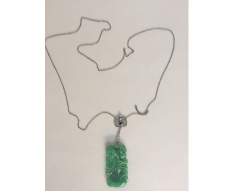 A Chinese green jade pendant carved as a grasshopper in foliage suspended from a platinum, diamond and emerald lotus leaf sha