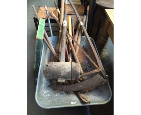 A quantity of vintage tools including a Trollner vintage metal wheelbarrow, various mallets, axes, sheers and a scithe