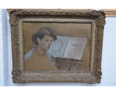 An original oil portrait study of a young man with dark hair, oil on canvas, remain of old labels en verso, framed, 40 x 30cm