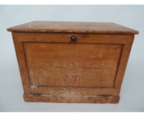 A vintage pine chest with drop down door, metal side handles and internal shelf, 43 x 72 x 54cm