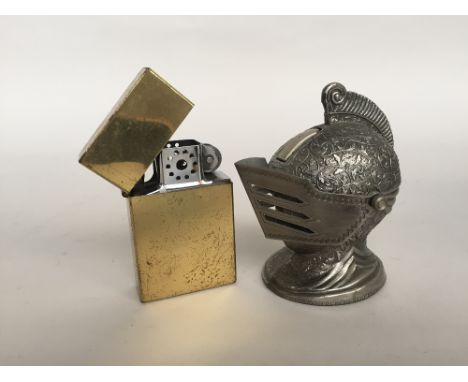 A vintage Metal Knight Helmet Cigarette Lighter together with a zippo style large lighter 9.5cm H