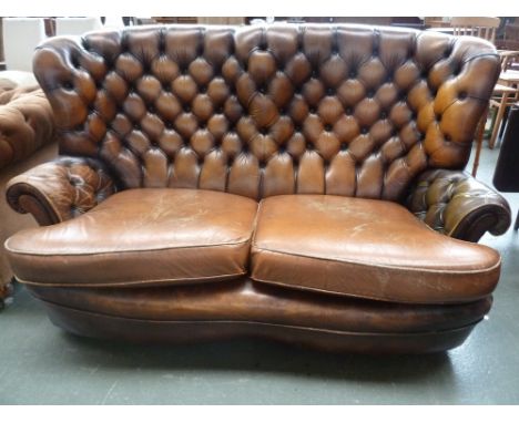 A high back two seater Chesterfield style sofa, brown leather button back upholstry