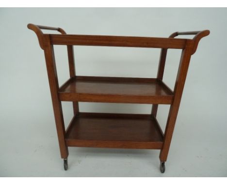 A Teak three shelf drinks trolley of tapered shape on castor 67x40x78cm