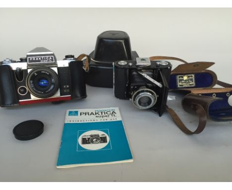Vintage Praktica FX Super TL 35mm Camera in Original Leather Case and instruction manual together with a vintage Zeiss Ikon N
