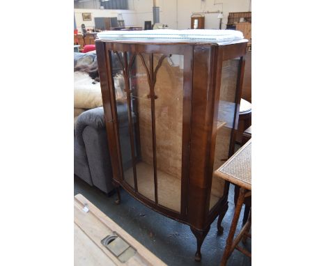 A bow fronted display cabinet with glass doors and side panels and two internal shelves on cabriole legs 73 x 36 x 120cm