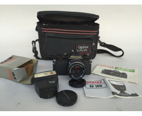 A Pentax MV 35mm with a SMC Pentax - M 1:1.7 50 mm lens, a HOYA 49mm filter, a Pentax AF 160 flash in original box  with the 