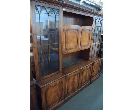 A 20th century mahogany cupboard unit, shelf over two cupboards above two cupboards with bracket feet