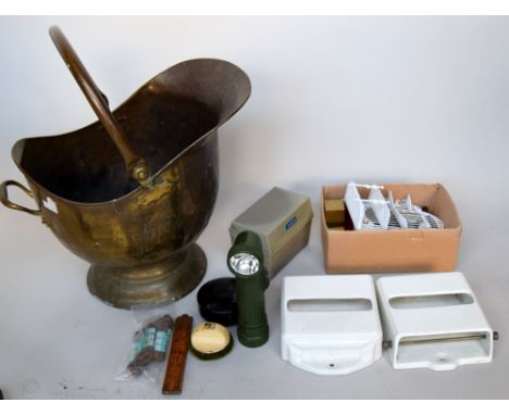 An early 20th century brass coal bucket together with some coins, a vintage GPG torch and wooden and brass rule, together wit