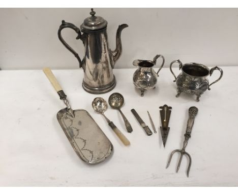 A selection of Silver plated items including a sugar bowl and milk jug with applied swan handles on scrolling feet with engra