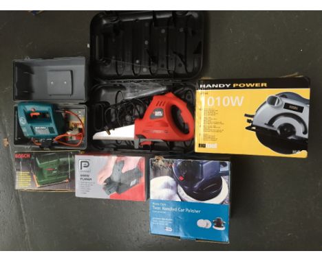 A selection of boxed tools including a Performance 650W Planer, a Bosch Orbital Sander PSS2, a Woolworths Workshop Heavy Duty