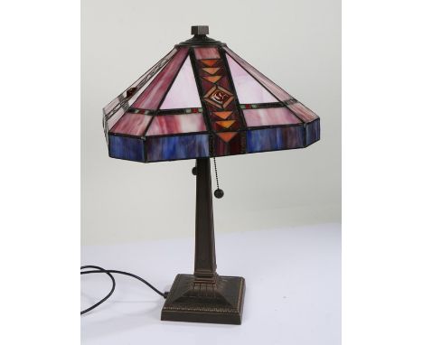 Tiffany style table lamp, in the Art Nouveau taste, with amethyst and leaded shade above a square tapering column and square 