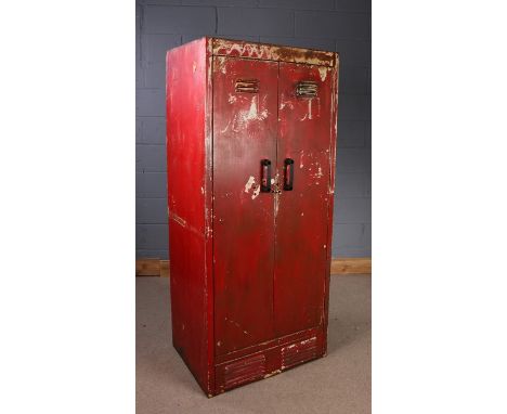 20th Century industrial steel cabinet, painted in red, the pair of vented hinged doors enclosing sets of hooks and shelf runn