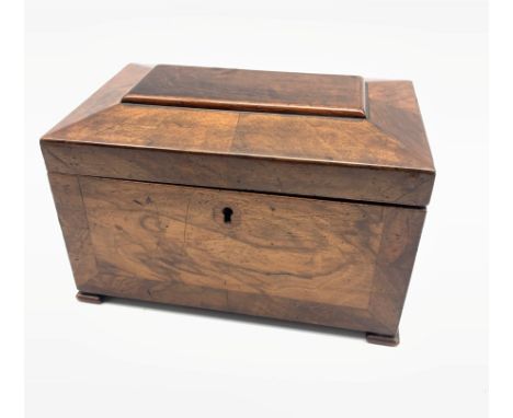 Late Georgian walnut tea caddy of sarcophagus design, the interior in burr elm, walnut and rosewood with two covered containe