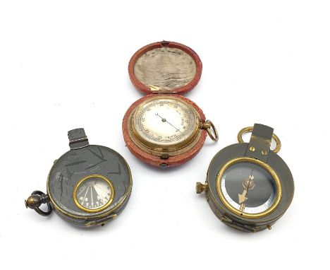 World War I marching compass in a leather case inscribed C &amp; R Brinsley 1916, another and a pocket barometer in outer lea