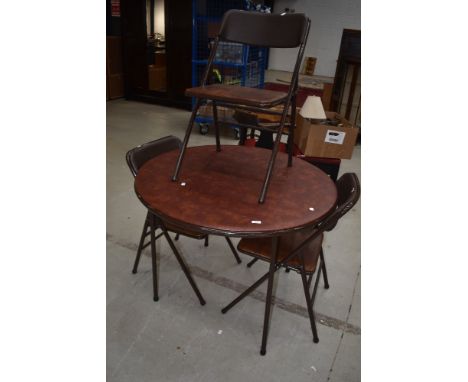 A vintage folding metal circular table and set of three similar chairs, labelled Cosco, with vinyl top