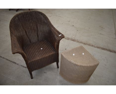 A vintage Lloyd Loom tub chair and corner linen basket