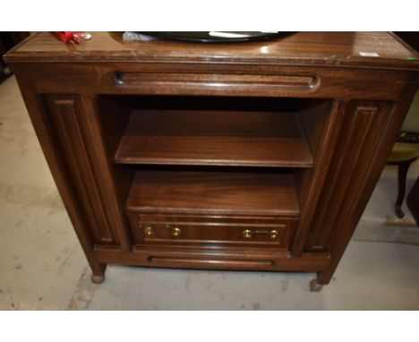 A media centre cabinet having drawers storage and shelf