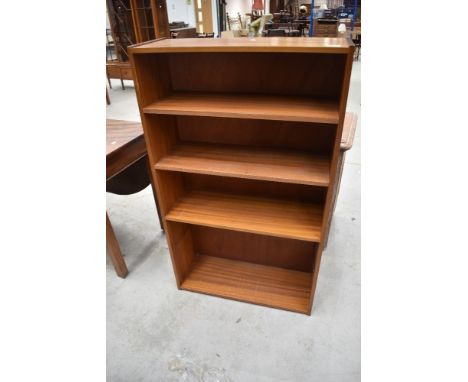 A vintage sapele bookshelf
measuring 119cm x 69cm x 25.5cm, lower shelf missing.