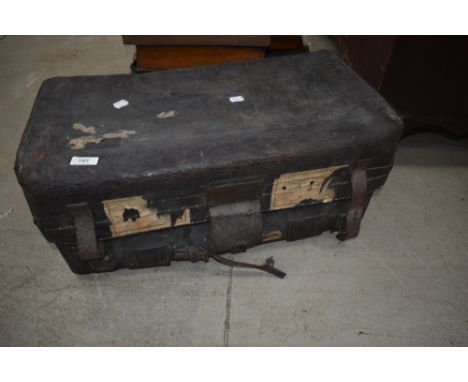 A vintage leather travel trunk