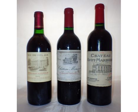 Three bottles of vintage wine Chateau Marsauda 1990 Chateau Haut Marbuzet 2005 and a Roc du bel air Bordeaux Superieur 1992