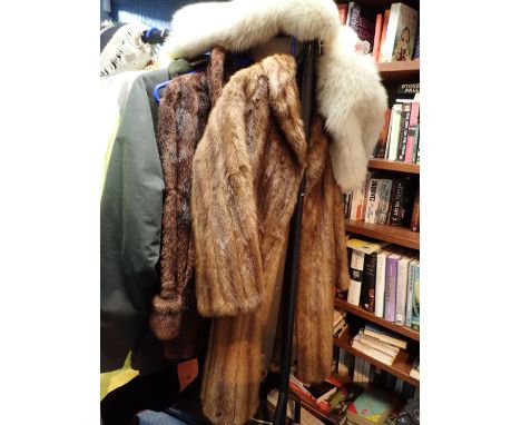 Three furs including mink coat fox cape and one other