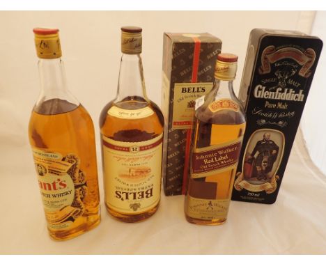 Five bottles of Scotch whisky including Bells Grants and Johnnie Walker Red Label 