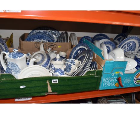 FOUR BOXES OF BLUE AND WHITE CERAMICS to include a large quantity of 'Willow' pattern items from various manufacturers to inc