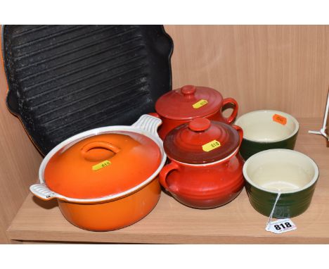 A GROUP OF LE CREUSET AND SIMILAR COOKWARE, comprising an orange Le Creuset cast iron griddle pan, two Le Creuset individual 