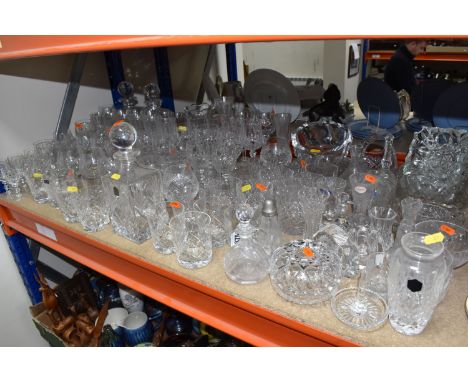 A LARGE GROUP OF CUT GLASS ITEMS, to include decanters, bud vases, bowls, dressing table items, vases, various style glasses,