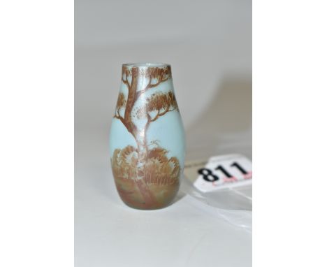 A DAUM MINIATURE VASE, of baluster form, painted with a brown monochrome scene of a tree in a landscape, on a pale blue groun