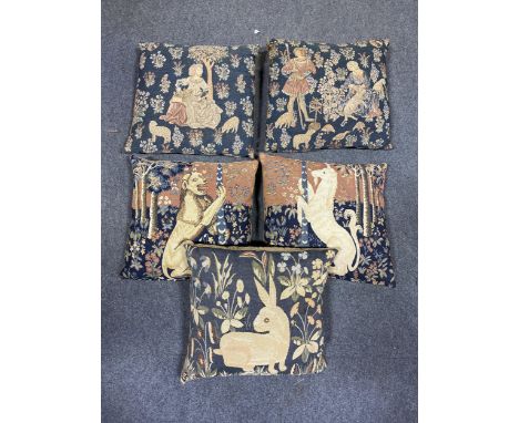 Tapestry cushions depicting the lion, unicorn and rabbit from 'The Lady and the Unicorn'; two other medieval-style tapestry c