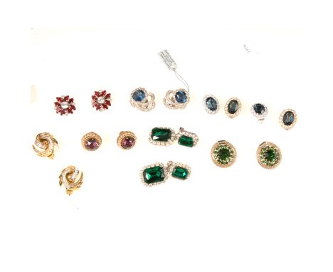 Eight pairs of costume earrings set with simulated rubies, emeralds and sapphires. a pair of Jomaz blue and white paste spray