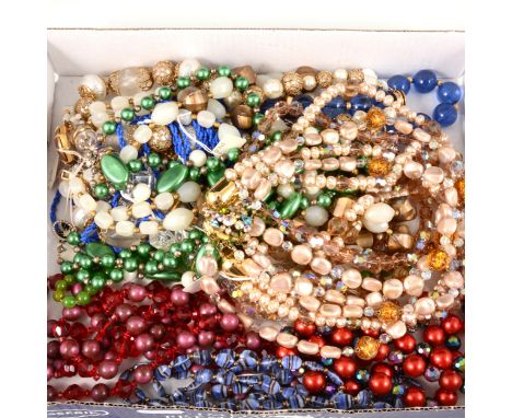 Twelve vintage costume jewellery necklaces, circa 1970's, plastic and coloured glass beads, single strands to five strand, an