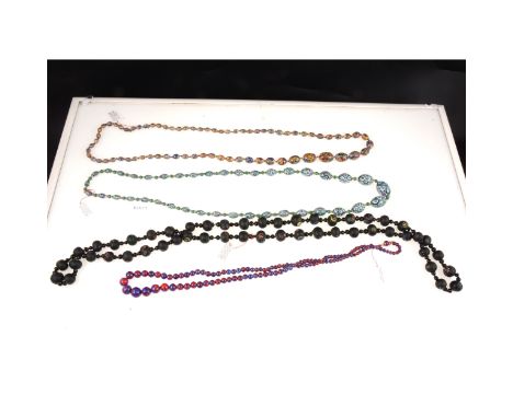 Four vintage opaque glass bead necklaces, circa 1920/1930, a rope of millefiori graduated egg shaped green beads, 90cm, multi