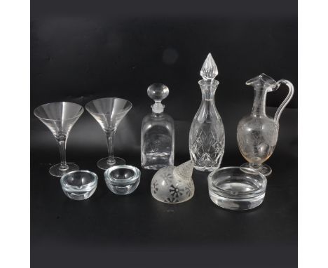 A cut glass decanter, 34cm; a plain decanter, with motto 'Lumen Coeleste Sequamur' beneath star and crescent on body, 26cm; a