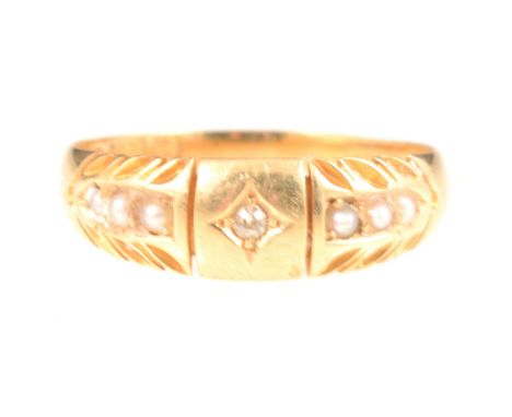 A 15 carat yellow gold ring set with a small old cut diamond in a tapered band with three seed pearls to each shoulder, hallm