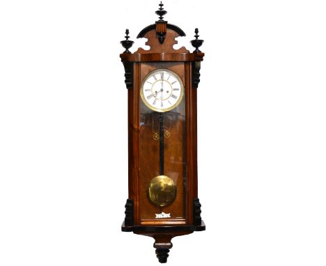 A 19th Century walnut cased Vienna clock, double weighted eight-day movement striking on a gong, 102cm.