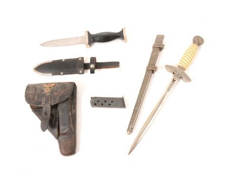 German dagger by ERN Solingen, damage to handle, with leather scabbard, a German leather pistol holster, and a replica dagger