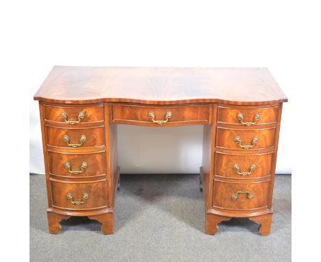 Reproduction mahogany twin pedestal desk, serpentine top, nine drawers, bracket feet, width 115cm, depth 55cm, height 75cm.