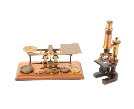 Leitz monocular field microscope, and a set of postal scales and weights.