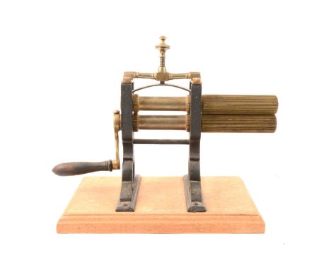 Vintage iron and brass crimping machine, overall length 35cm.