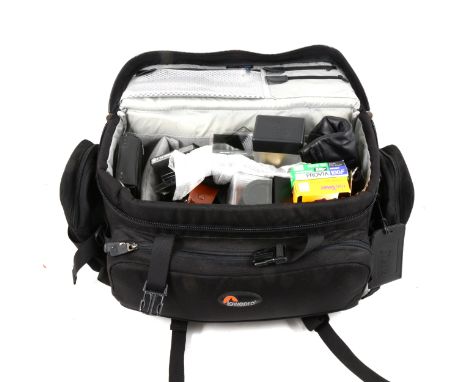 A Lowepro camera bag with a selection of Cokin camera filters, Hasselblad 50-70 bellows for f/250 CF &amp; C/120-150 CF &amp;