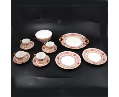 A D&amp;C France part teaset, comprising cake plates, side plates, cups, saucers and a large bowl, white ground, gold stars w