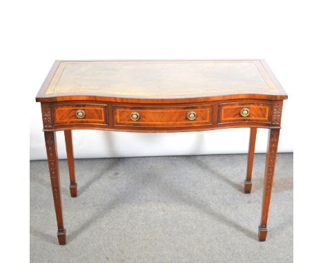 Reproduction mahogany desk, serpenting top with leather inset, three frieze drawers, square tapering legs, width 102cm, depth