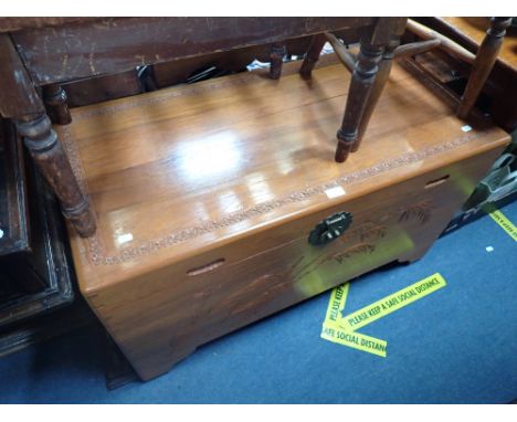 A FAR EASTERN CARVED CAMPHOR TRUNK, 102cm wide