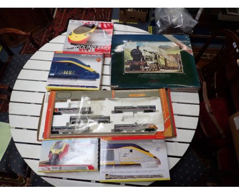A COLLECTION OF 00 GAUGE BOXED TRAIN PACKS, to include a Hornby 'Eurostar' and Bachmann 'Virgin Voyager' (some sets incomplet