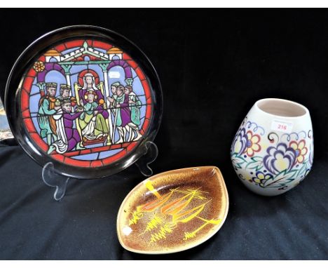 A POOLE POTTERY VASE with traditional painted decoration, 20cm high, a Poole charger from the Medieval Calendar series, and a